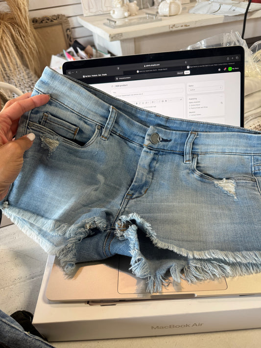 light blue ripped blank nye shorts size 4