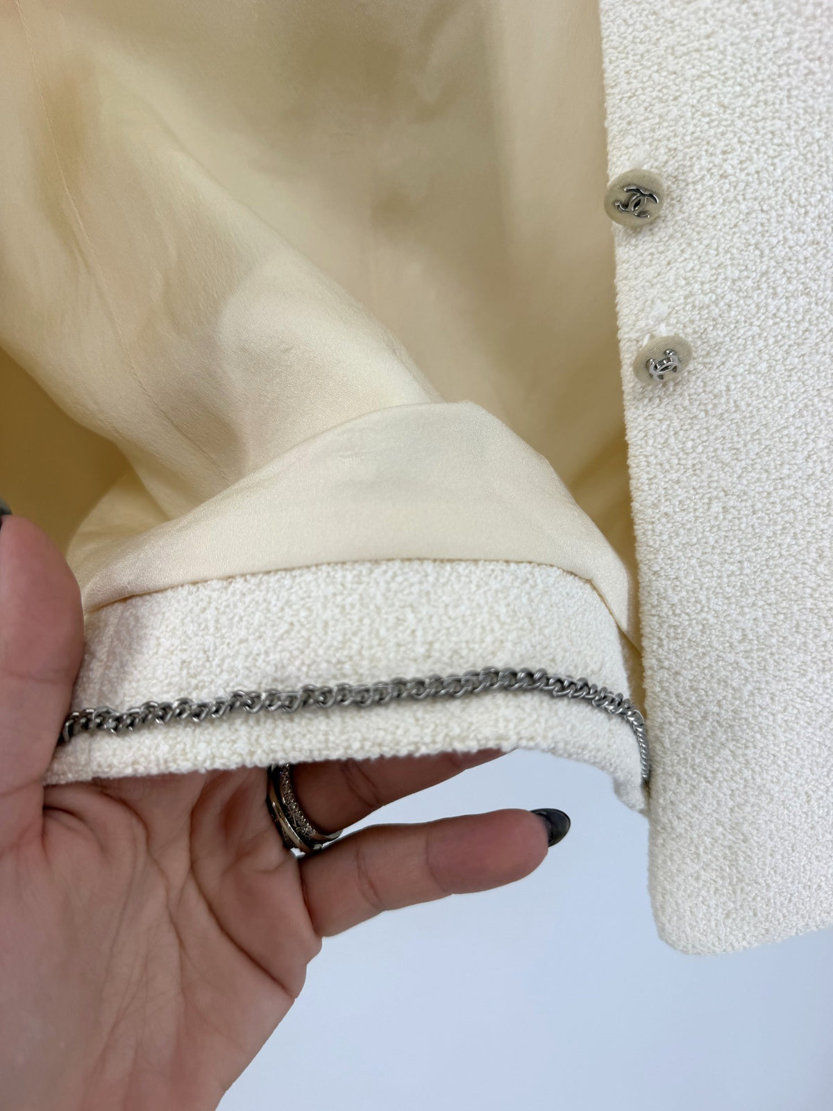 Chanel Boutique Cropped Ivory Bouclé Jacket Chain Hem