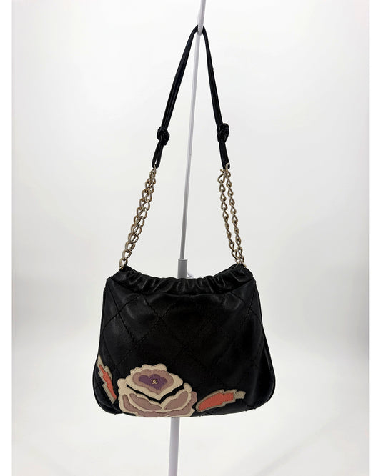 Chanel Black Quilted Lambskin Drawstring Bucket Bag Floral CC Applique Chain Strap