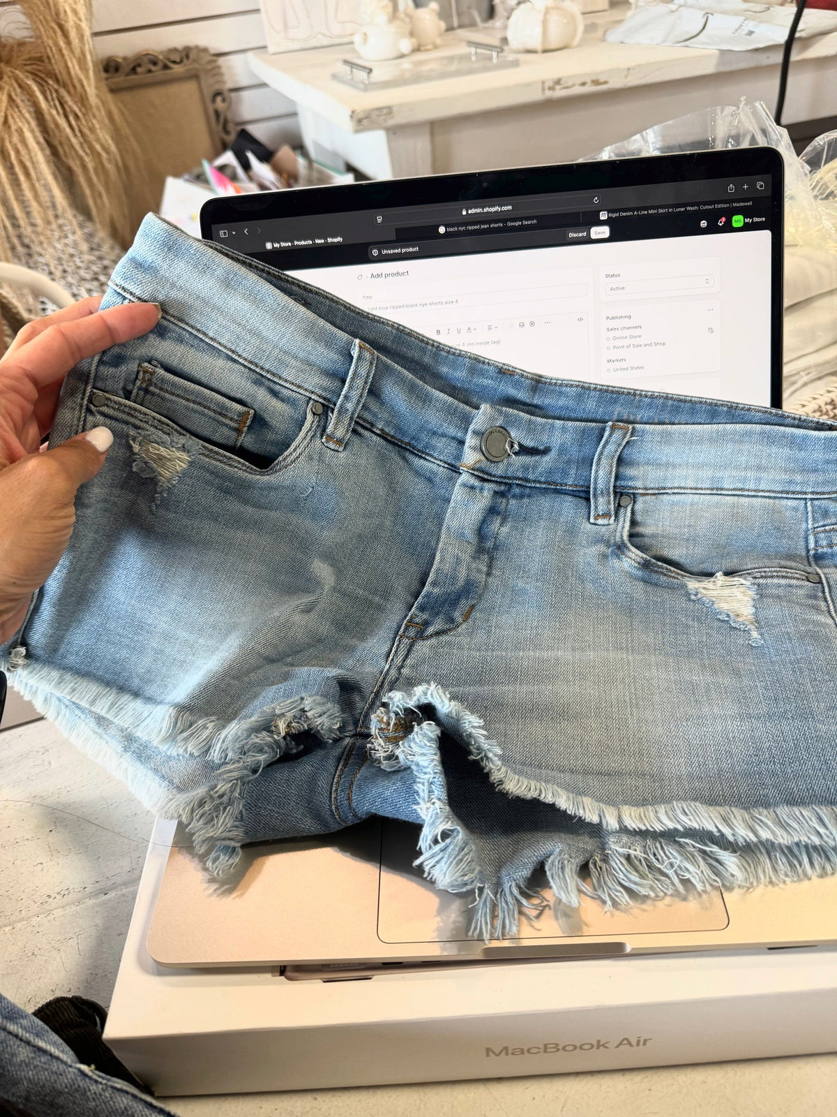 light blue ripped blank nye shorts size 4